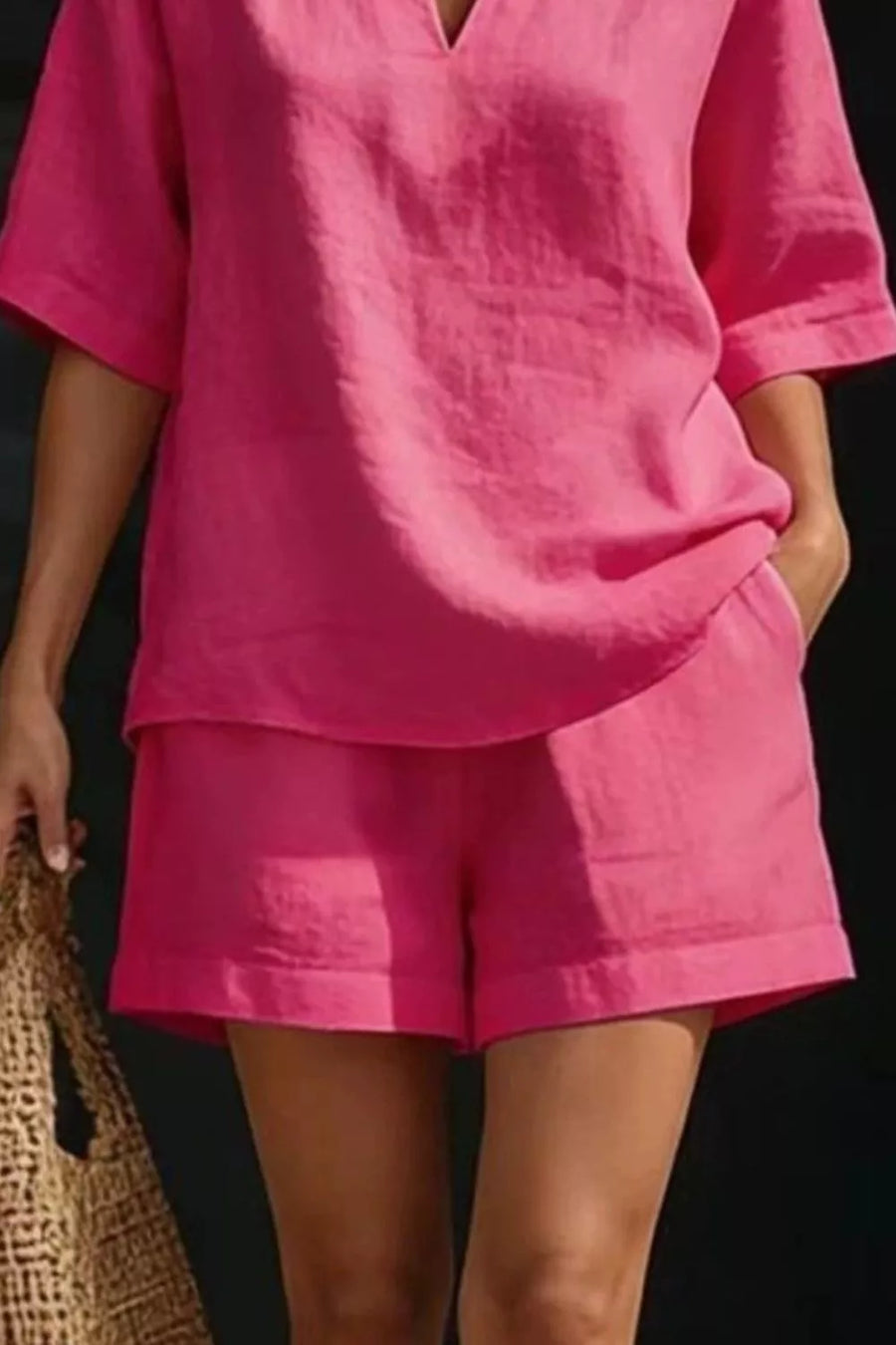 Hot pink notched top and pocketed shorts set, comfortable loungewear for women.