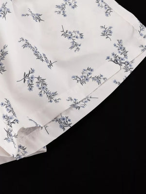 White shorts with blue floral print and side slits