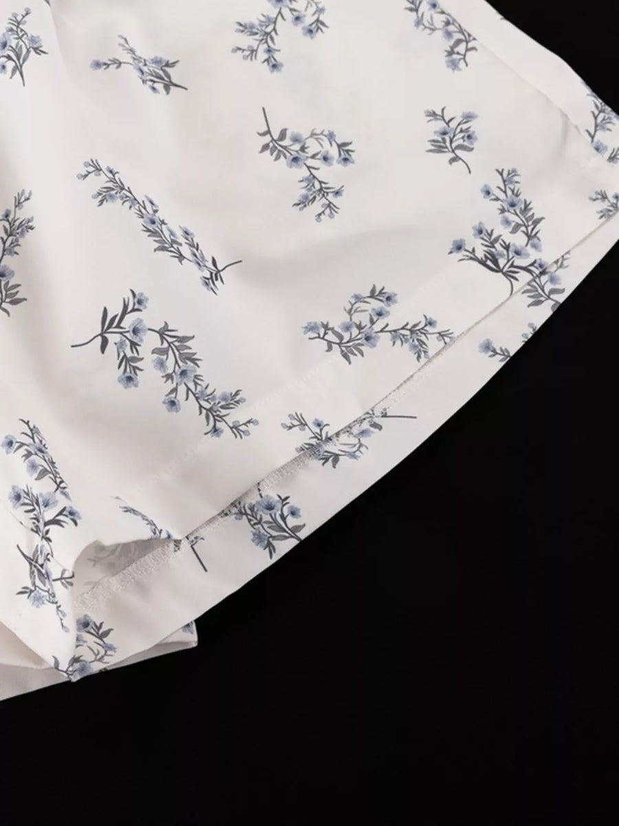 White shorts with blue floral print and side slits