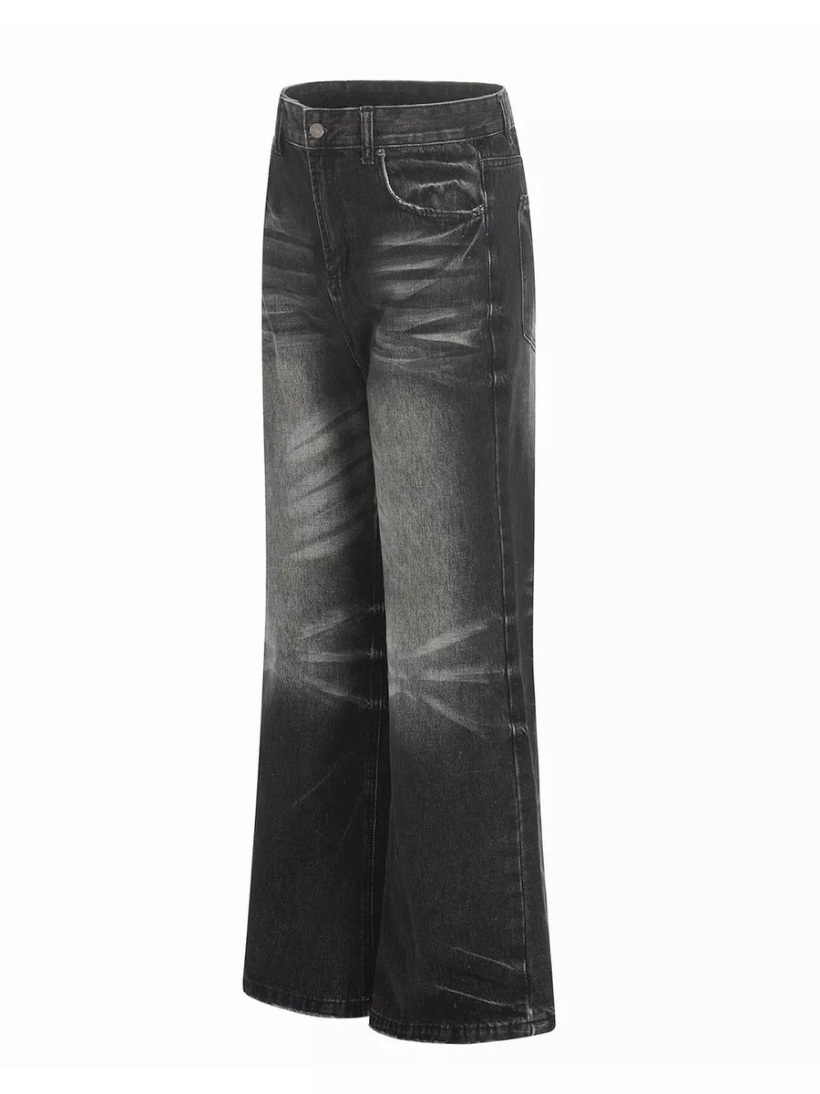Men's vintage wash wide leg jeans in black with distressed details.