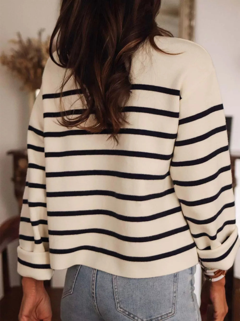 Navy and cream striped button-front cardigan with cuffed sleeves.
