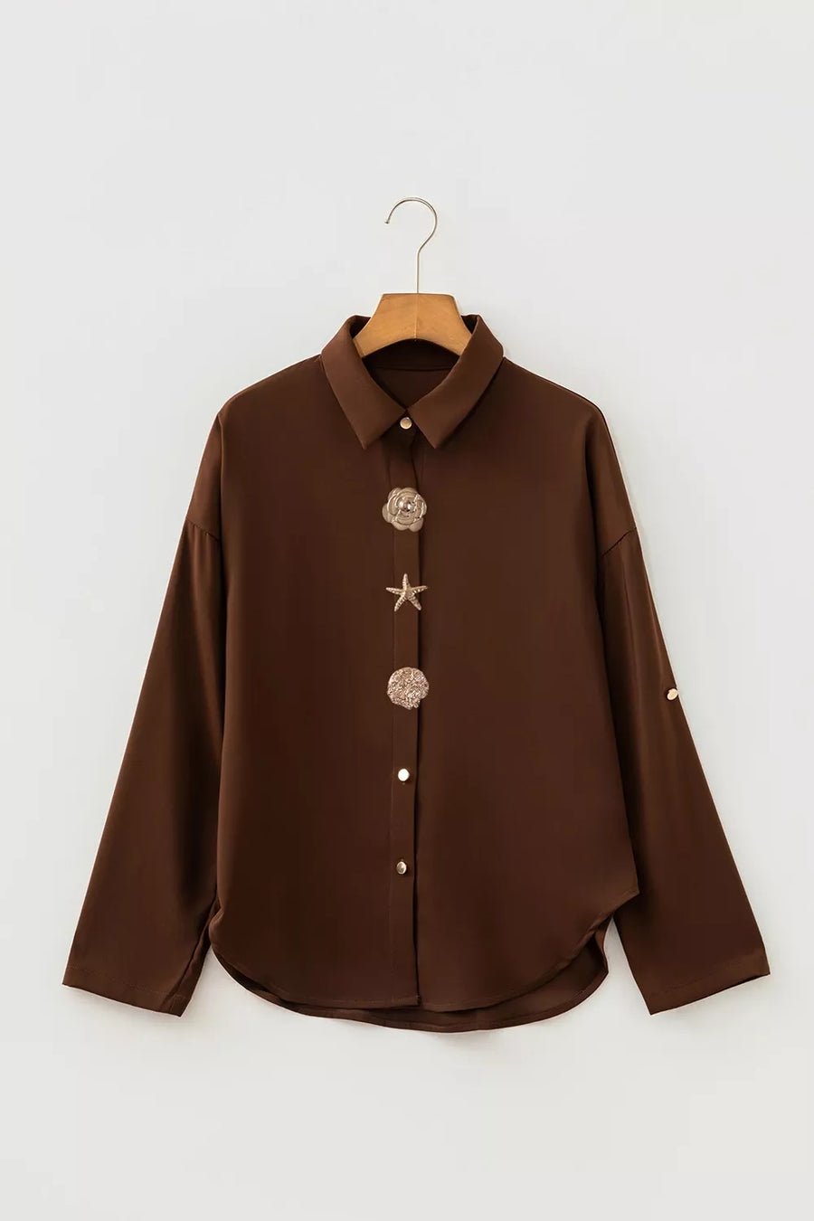 button-up shirt in dark brown with buttoned and hip-length