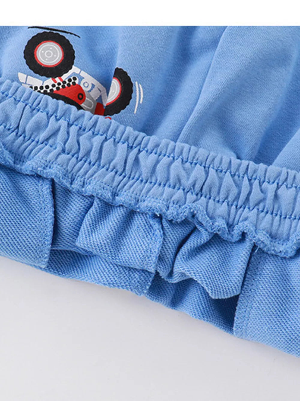 Blue toddler shorts with elastic waist and ATV print detail.