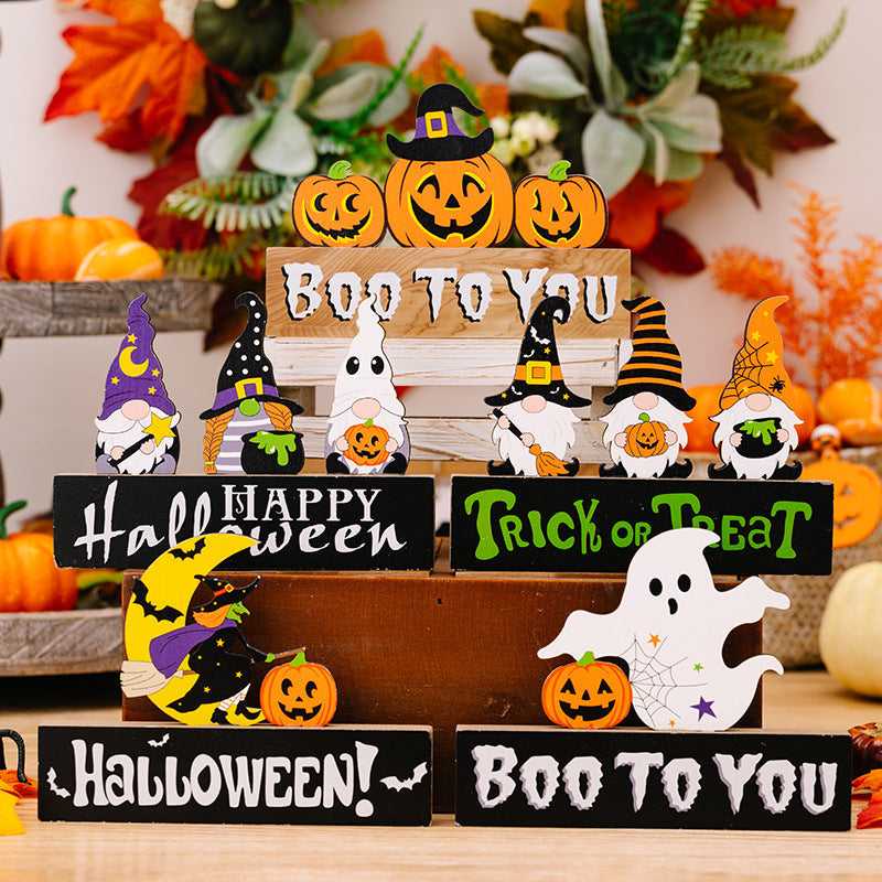 Halloween gnome trio display with pumpkins and ghost decor.