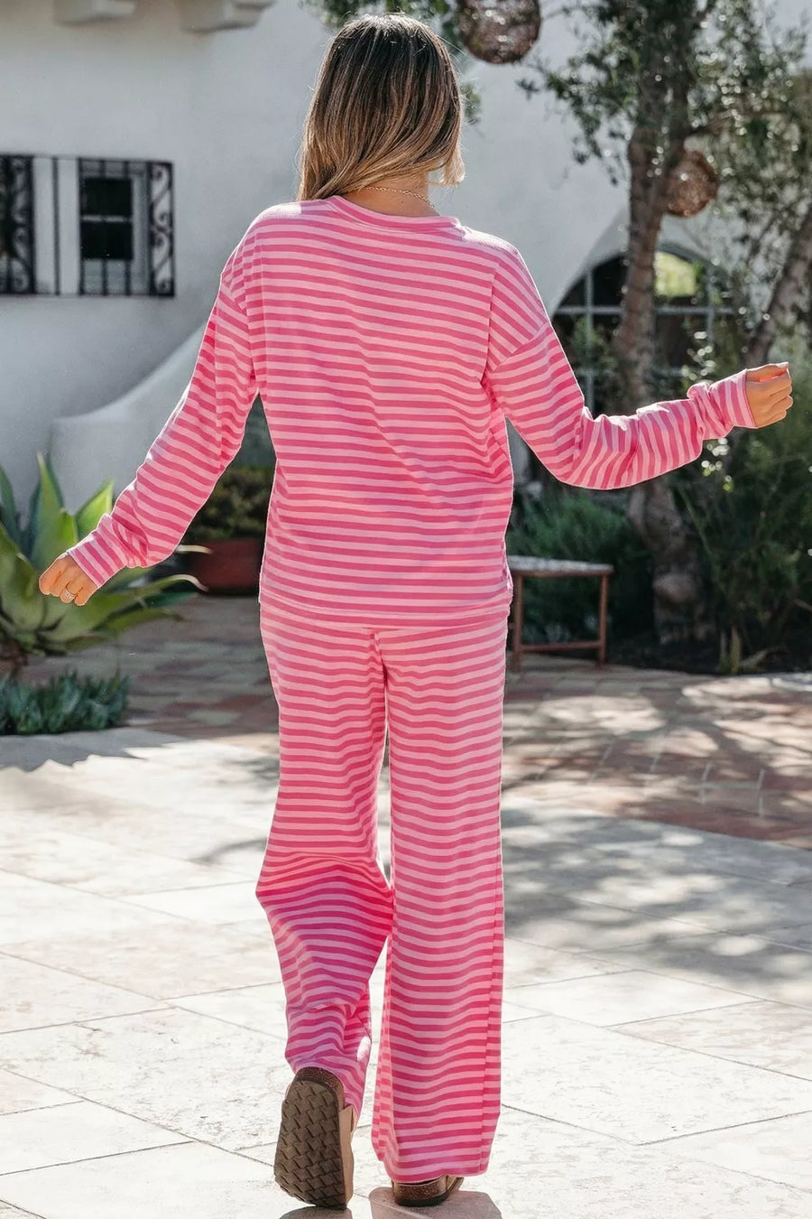 Pink striped cotton two-piece set with crew neck top and wide-leg pants.