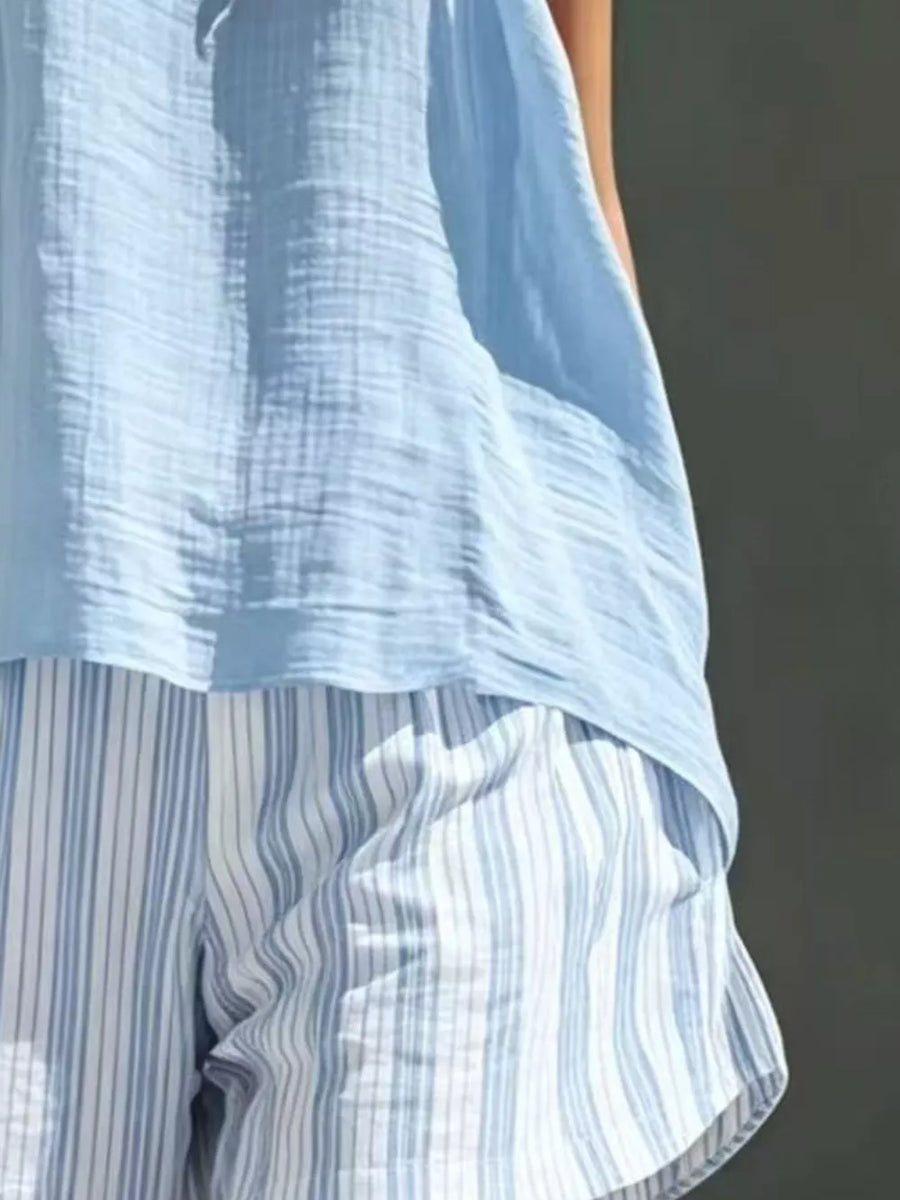 Light blue crinkled tank top over white and blue striped shorts
