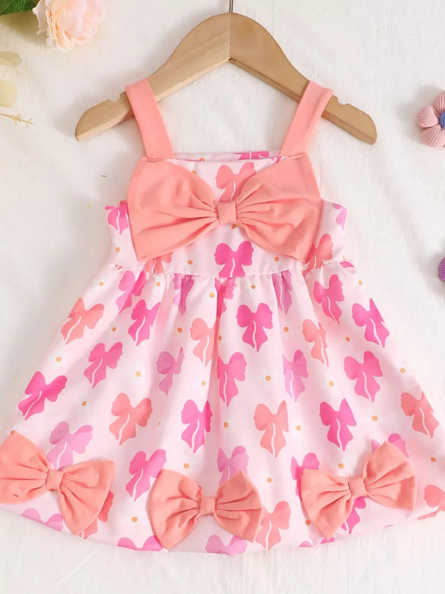 Pink cotton baby dress with bow print and bow details
