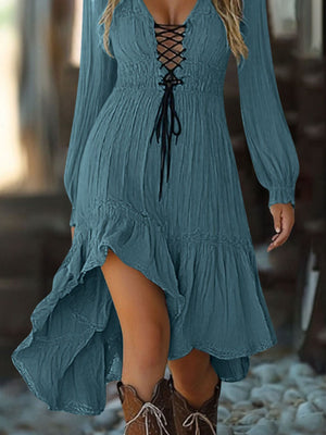 Peacock blue lace-up ruffled high-low dress with long sleeves and a tiered hem.
