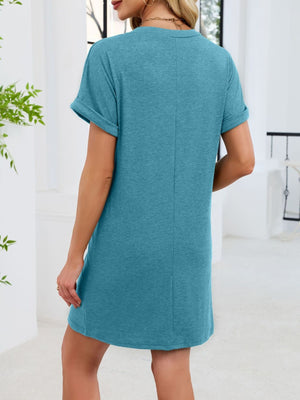Blue-green t-shirt dress with cuffed short sleeves and a V-neckline.