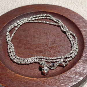silver necklace with layered chain and not applicable