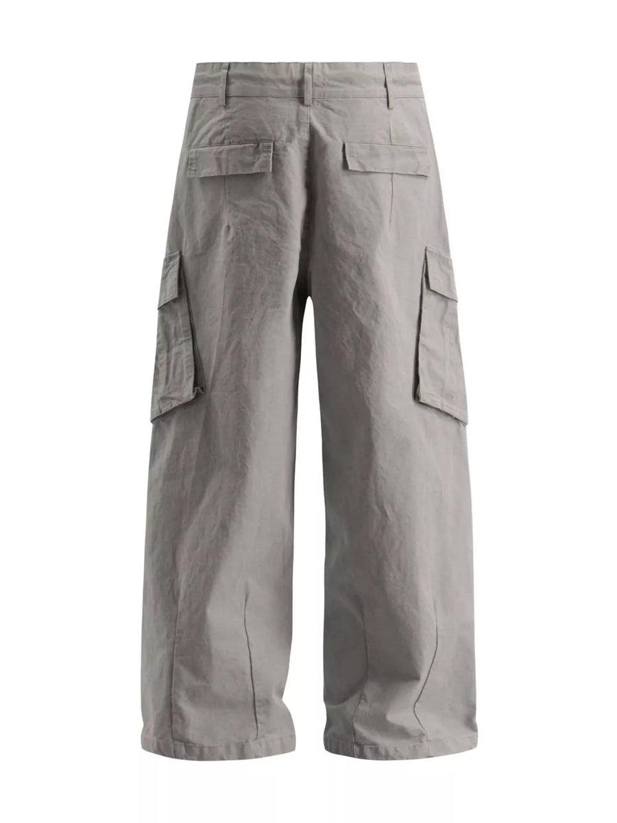 Grey wide-leg cargo pants with multiple flap pockets and a relaxed fit.