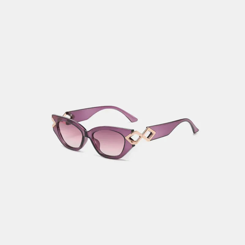 Geometric accent cat-eye sunglasses in purple with gold diamond details.