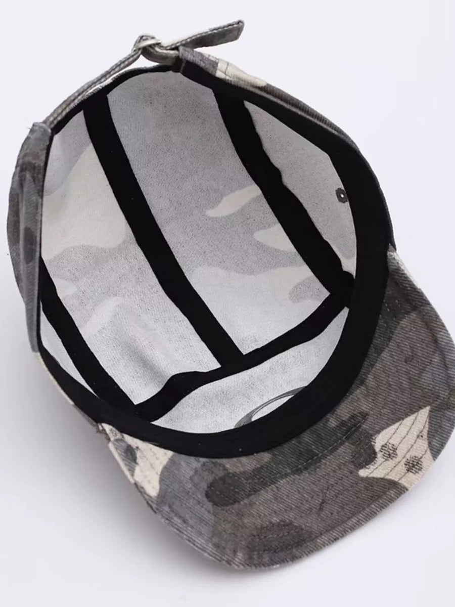 Camouflage baseball cap with adjustable strap and black interior lining.
