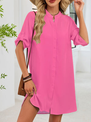 Fuchsia pink button-down shirt dress with band collar and rolled sleeves.