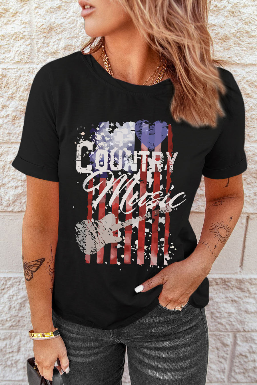 Black country music graphic tee with distressed American flag and guitar design.