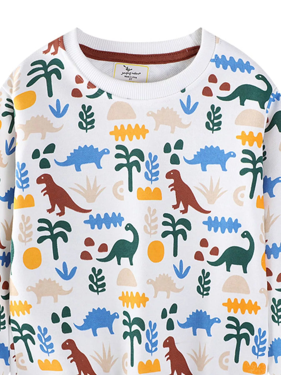White kids sweatshirt with allover dinosaur and palm tree print.