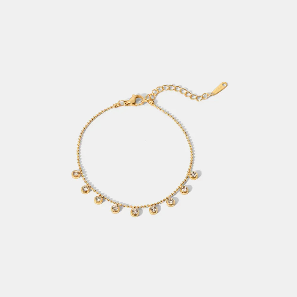 Gold bracelet with dangling zirconia beads, 18K gold-plated chain.