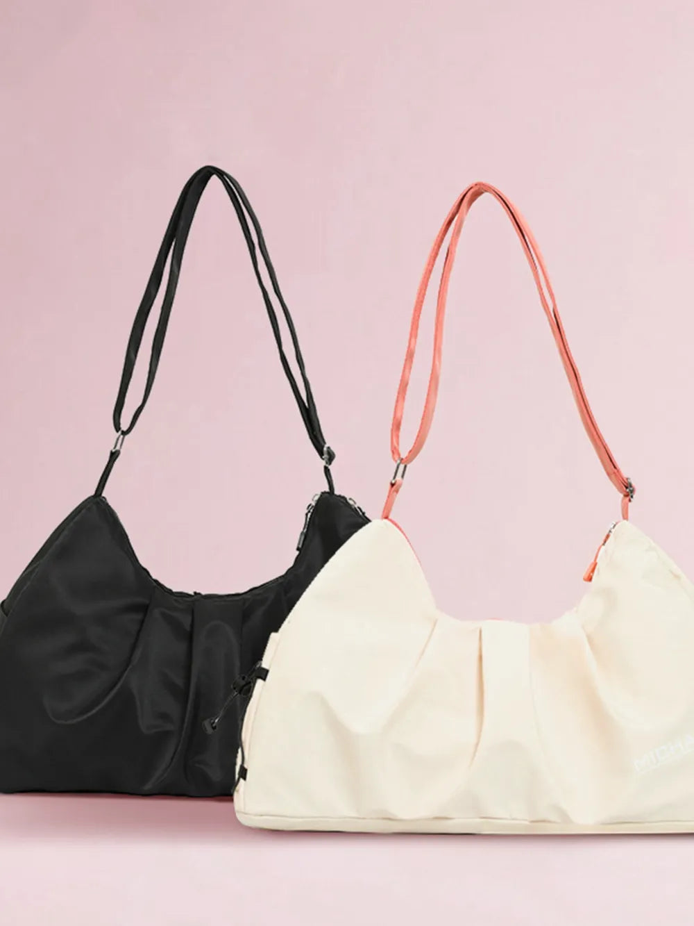 Gathered pleat crossbody bags in black and beige with adjustable straps.