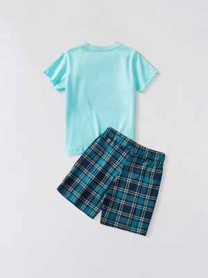 Toddler graphic tee and shorts set in aqua blue cotton with blue plaid shorts.