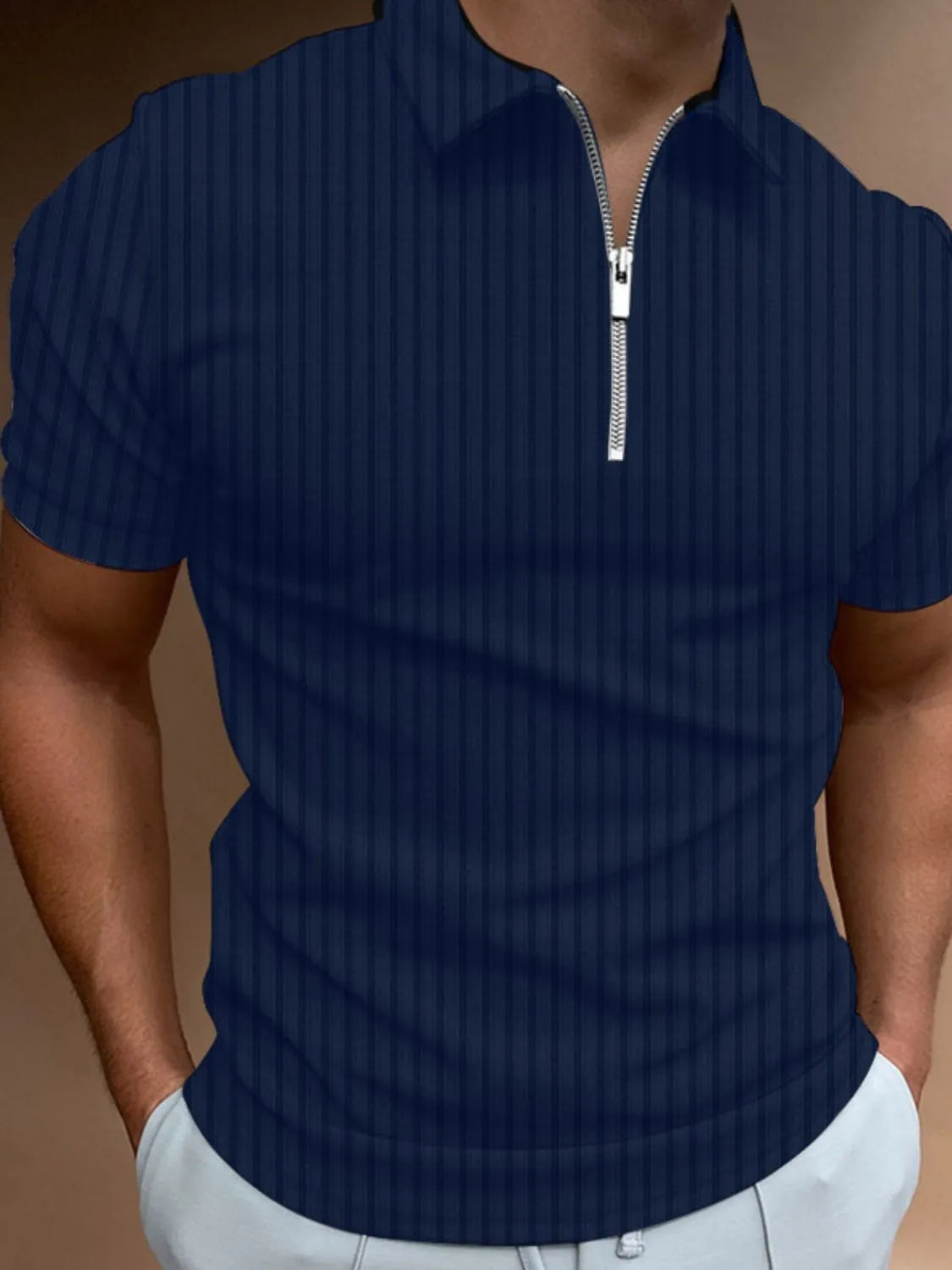 Navy ribbed zip-neck polo shirt with short sleeves.