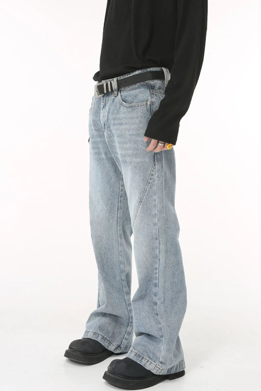 Flared denim jeans in medium wash with sculpted seam detail and bootcut leg.