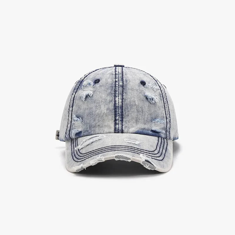 Light acid wash distressed denim baseball cap with frayed brim