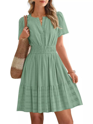Light Green Textured V-neck Tiered Dress with Smocked Waist and short sleeves.