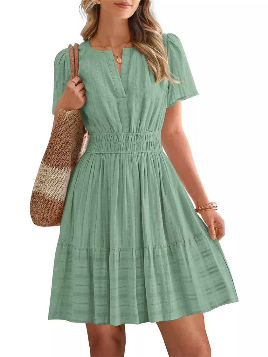 Light Green Textured V-neck Tiered Dress with Smocked Waist and short sleeves.
