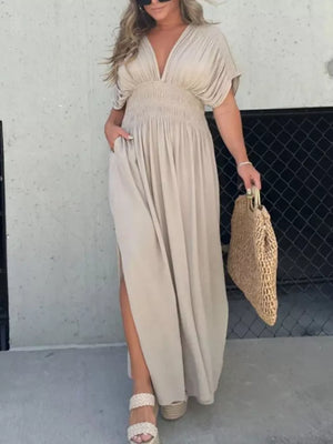Apricot V-neck dolman sleeve maxi dress with smocked waist and side slits.