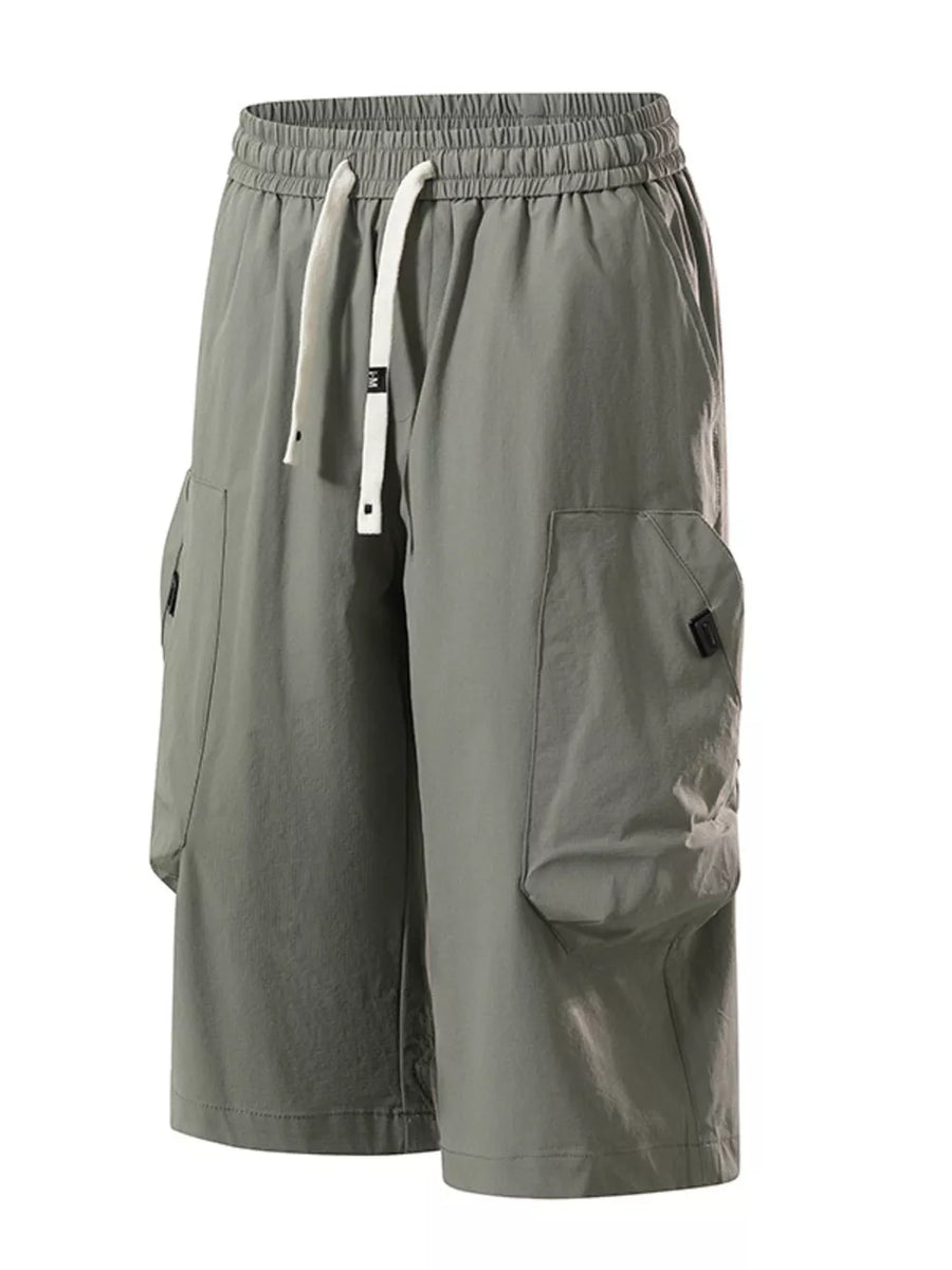 Light gray cargo capris with adjustable drawstring and large side pockets.
