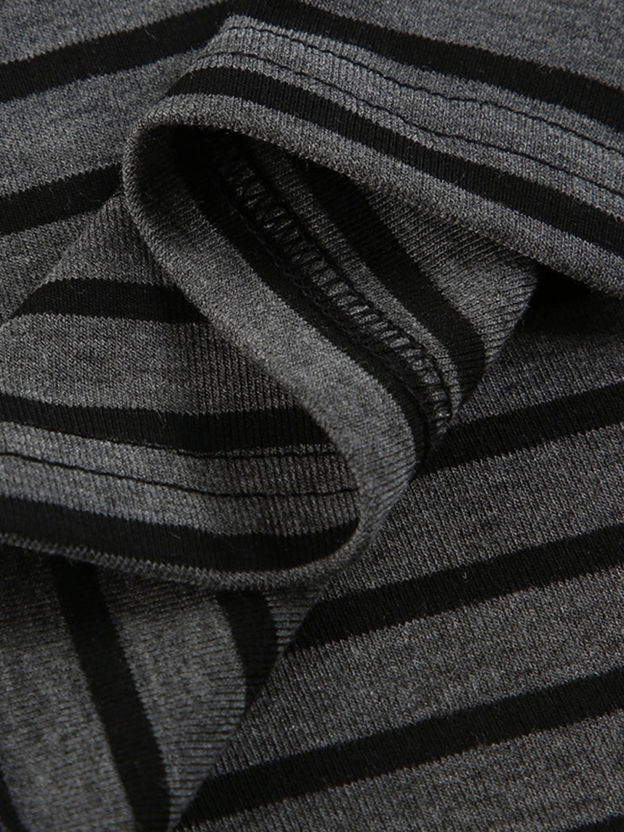 Grey and black striped t-shirt with a boat neck and comfortable stretch fabric.