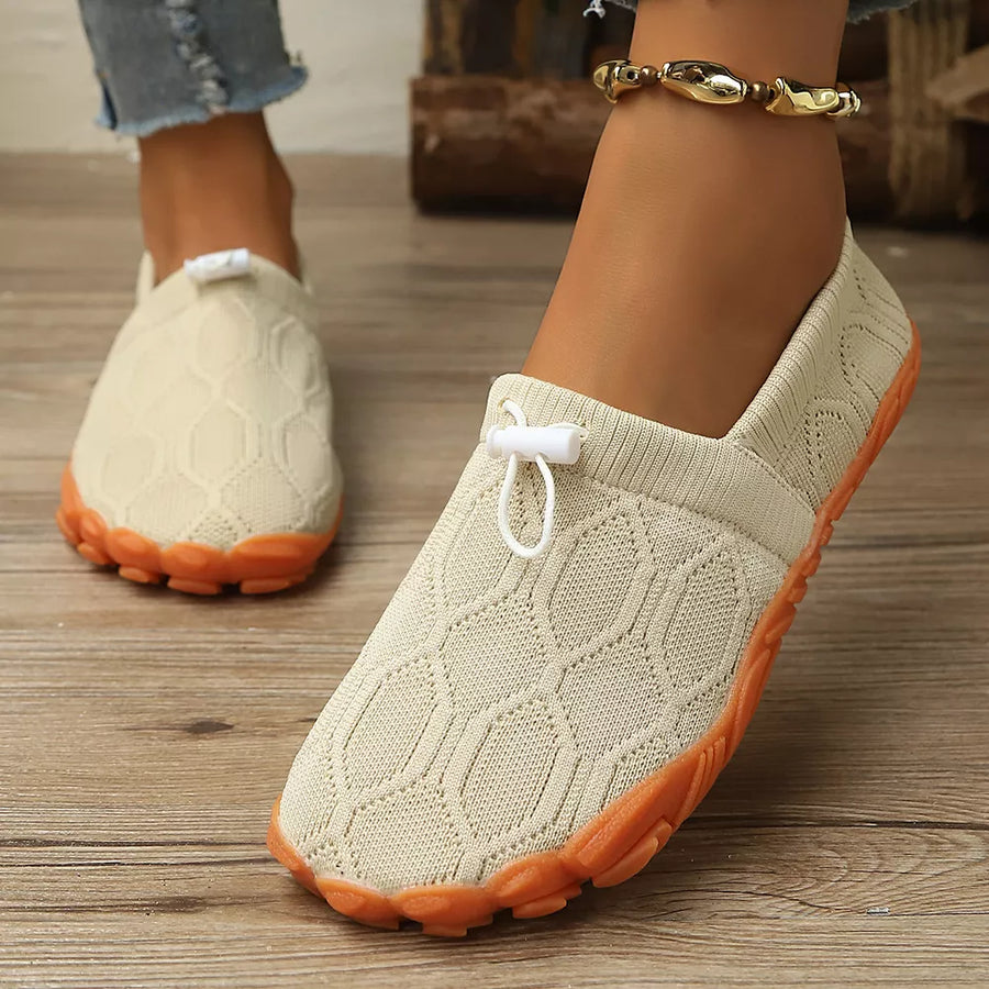 flats in rust brown with geometric and round toe