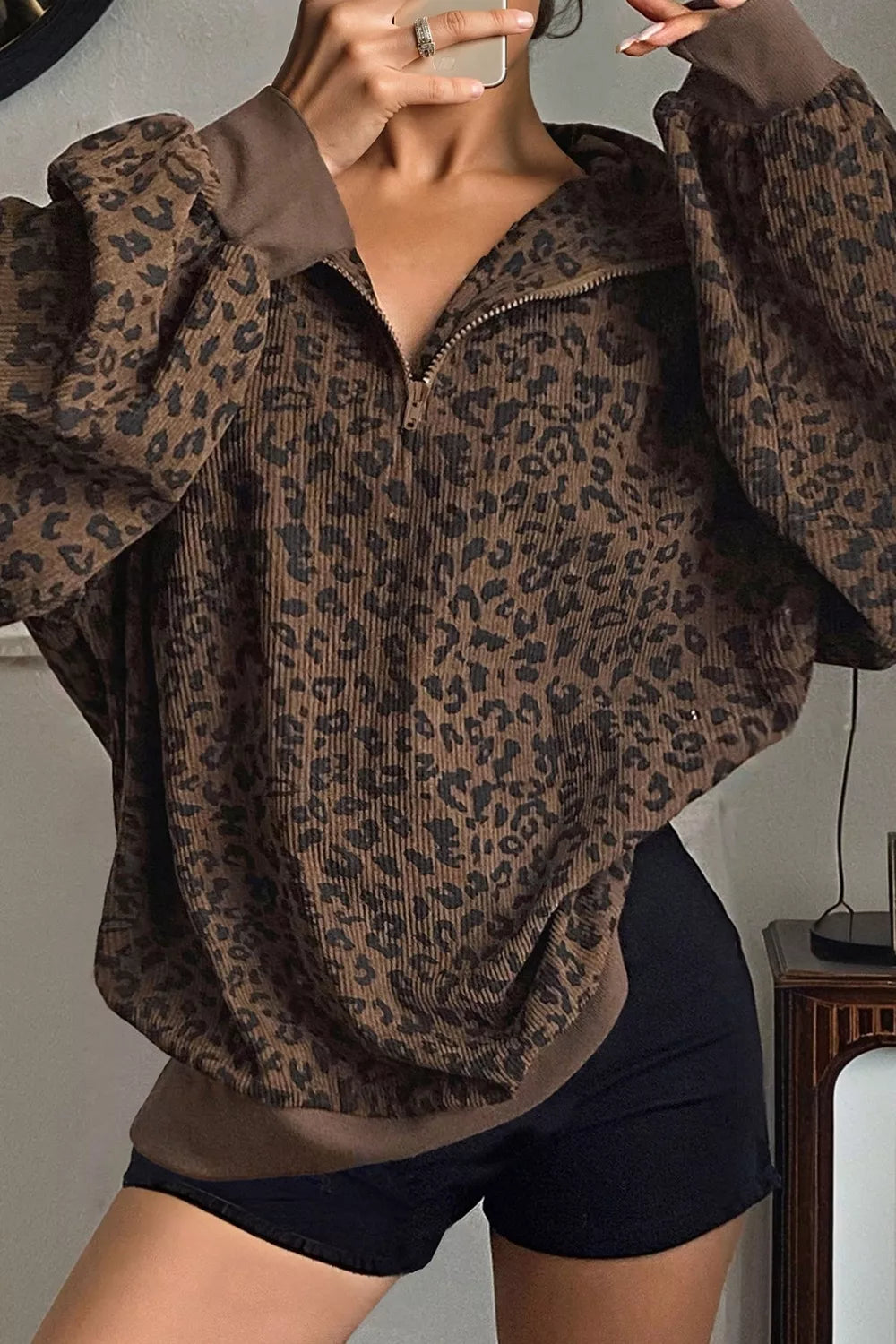 brown sweatshirt with hip-length and quarter-zip