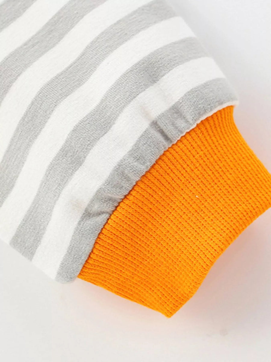 Light gray and white striped cotton sweatshirt cuff with orange ribbed trim.