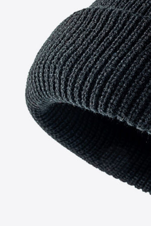 Folded edge ribbed knit beanie in dark gray acrylic.