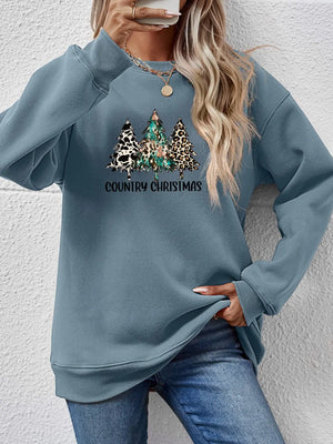French Blue sweatshirt with country Christmas trees graphic and leopard print detail.