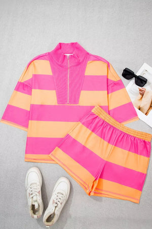 Vibrant striped two-piece set with drawstring shorts and a quarter-zip top in pink and orange.