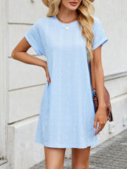 Light blue eyelet mini dress with diamond pattern, crew neck, and short sleeves.