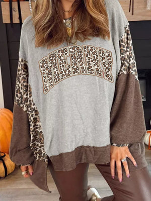 Gray sweatshirt with leopard print sleeves and "Merry" graphic.