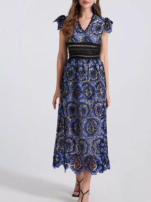 Blue floral lace midi dress with V-neck, short sleeves, and black waistband.