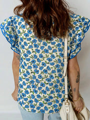 Floral ruffle sleeve blouse with blue floral print and contrast trim.
