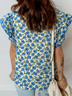 Floral ruffle sleeve blouse with blue floral print and contrast trim.