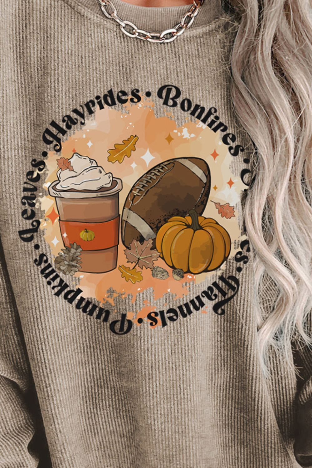 Khaki ribbed knit sweatshirt with a graphic featuring a coffee cup, football, and pumpkin.