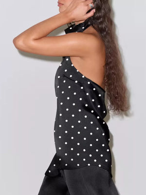 Black polka dot halter top with a collared neckline and open back.