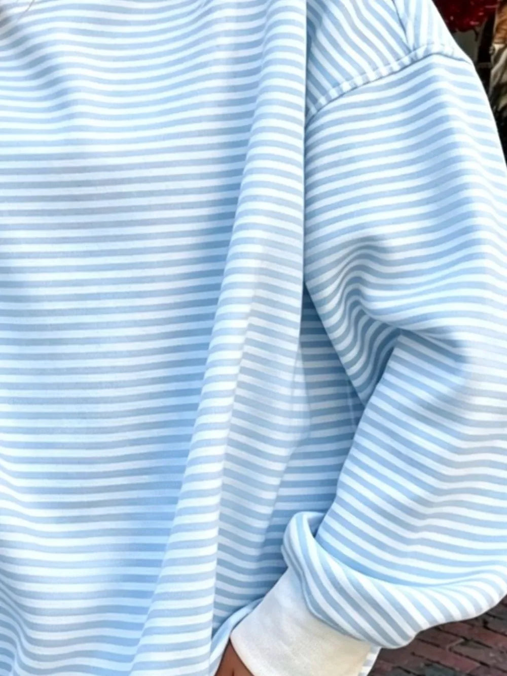 white sweatshirt featuring oversized and striped