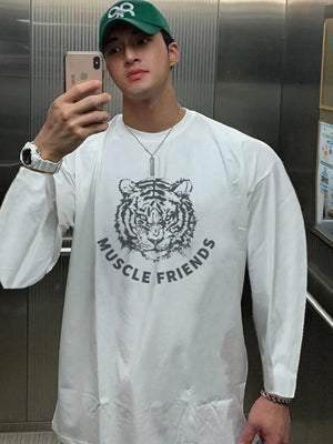 White long sleeve tee with tiger graphic and Muscle Friends text.