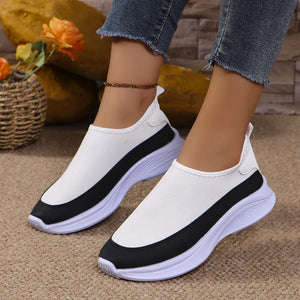 White mesh slip-on sneakers with black stripe detail and white sole