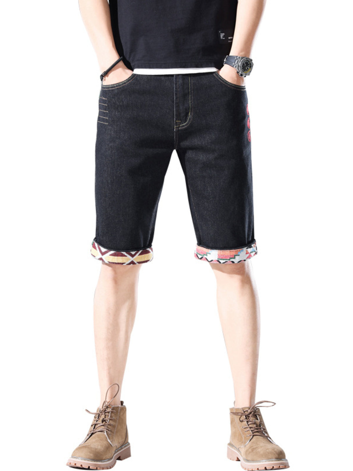 Men's black denim shorts with rolled cuffs featuring a colorful geometric pattern.