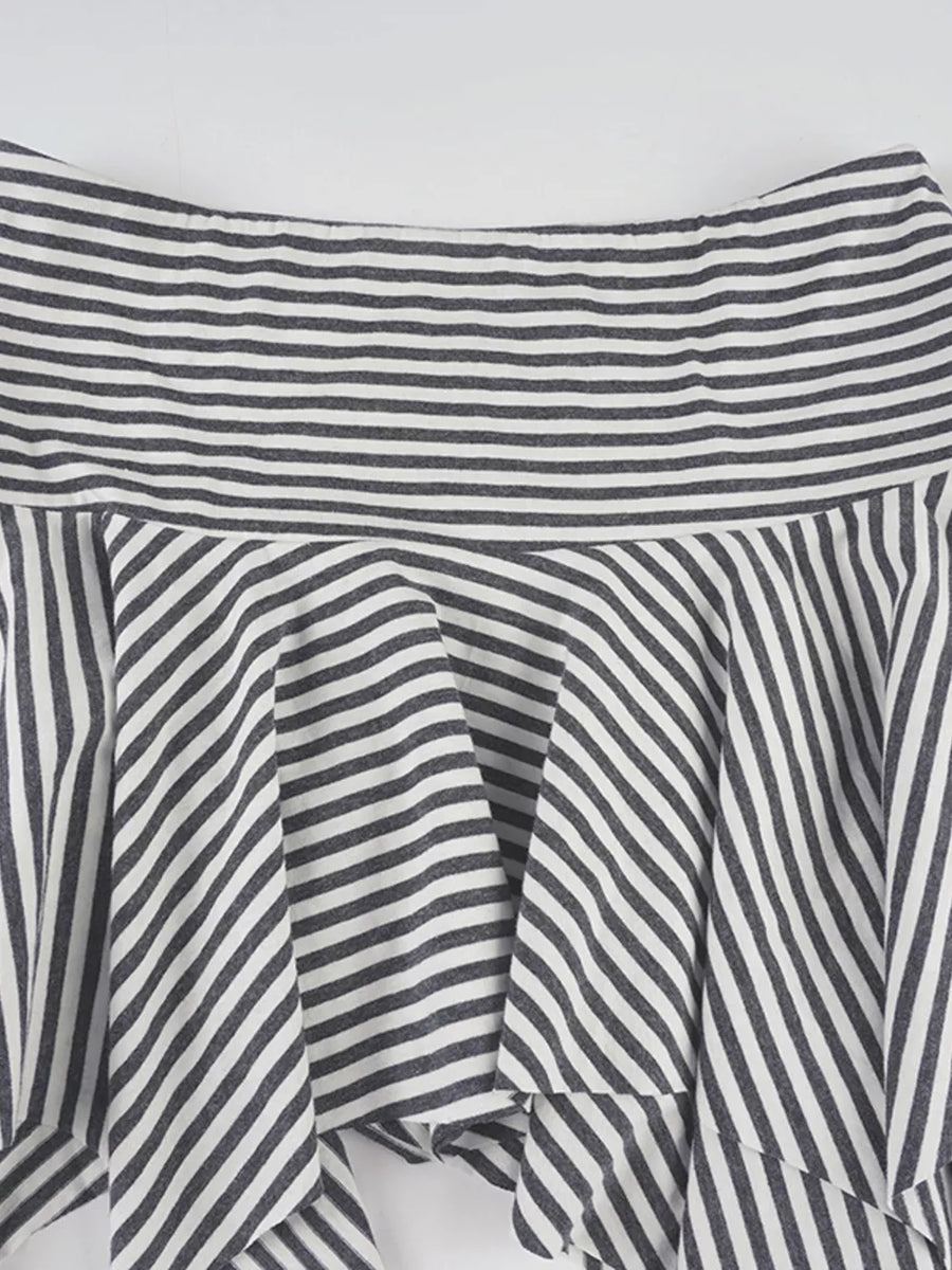Asymmetrical hem mini skirt with black and white stripes and a ruffled detail.