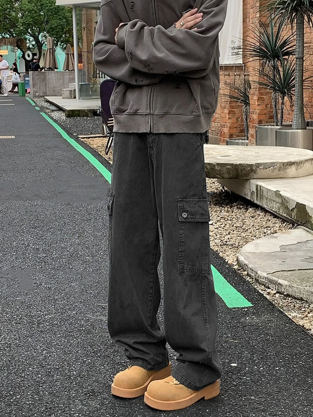 Gray casual loose fit cargo pants with multiple pockets and a relaxed silhouette.